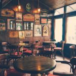 empty chairs and tables inside a traditional pub