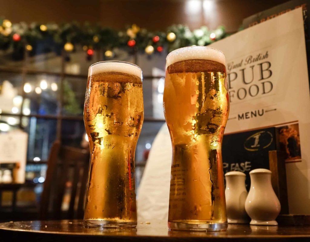pints of lager on pub counter