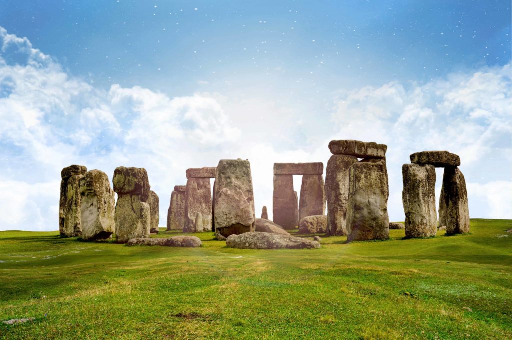 panoramic view of stonehenge on a clear day with blue skies
