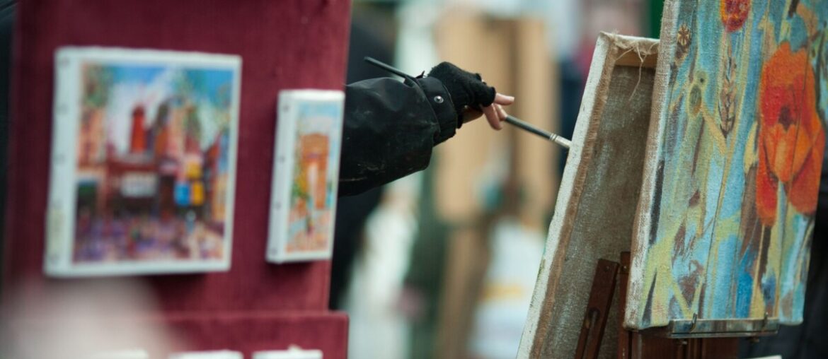 artists painting on canvas in montmartre