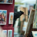 artists painting on canvas in montmartre