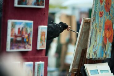 artists painting on canvas in montmartre