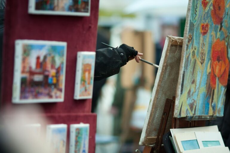 artists painting on canvas in montmartre